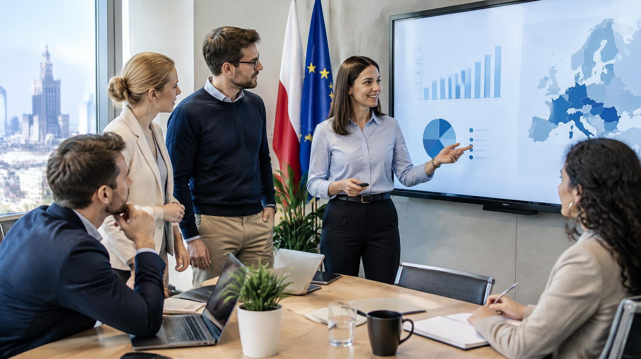 Business team discussing a presentation in a modern meeting room